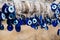 many traditional turkish Evil Eye Bead Amulets on the tree nazar boncuk from blue glass