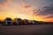 many transport trucks parked at a service station at sunset. Ai generative