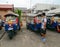 Many tuk tuk taxis parking on the station in Bangkok, Thailand