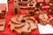 Many type and various of industrial iron casting parts on red table such as blower blade housing bearing connection joint cover