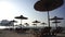 many umbrellas and sun chairs on the beach, symbolic photo for holidays, travel, sunburn, vacation.