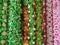 Many various colours flowers abstract pattern backgrounds, artificial flowers and garlands at shop at local market, Religious