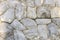 Many and various hard rock gray stone wall texture background.