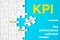 Many white jigsaw puzzle and KPI key performance indicator word on blue background - idea solution concept