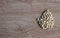 Many white nuts on a right old wood grain table corner and take a closeup and top view. left copy space for text input, the photo