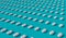 Many white tablets arranged in diagonal lines on blue background