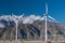 Many wind machines in the desert with cloudy skys