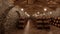 many wine barrels in a cellar with stone walls