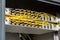 Many yellow fiber optic cables are inserted into the switches in multiple rows. Cable management. Horizontal orientation