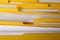 Many yellow files with documents as background, closeup