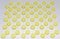 Many yellow pills, arranged in staggered order