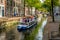 Many young students on a canal boat in a canal in Delft, the Netherlan
