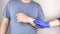 A manâ€™s wrist hurts. Traumatologist examines a hand. Wrist pain as a sign of tunnel syndrome or sprain, tendon degeneration