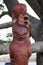 Maori carving style wood figure of Tupu a Rangi in details