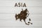 Map of the Asia made of roasted coffee beans laying