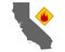 Map of California and pin with fire warning