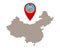 Map of China and pin with earthquake symbol