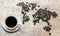 Map of continents from coffee beans on a wooden background