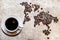 Map of continents from coffee beans on a wooden background