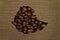 Map of Ethiopia made up of coffee beans on a background of canvas fabric