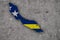 Map and flag of Curacao on weathered concrete