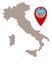 Map of Italy and pin with earthquake symbol