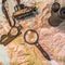 Map of Patagonia, compass, camera, monocular and loupe