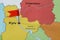 Map of Ukraine with red flag push pin placed on Kyiv, closeup