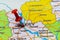 Map of Ukratne with a red push pin placed on the city of Kyiv. Selective focus