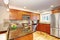 Maple kitchen cabinets with steel appliances and granite tops