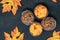 Maple leaves and Halloween Cupcakes on black background