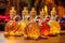 maple syrup bottles with different grades on a wooden table