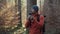 Maps outdoors while hiking. Hiker use smartphone to navigation in forest via app cartography. Trekking routes by