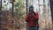 Maps outdoors while hiking. Hiker use smartphone to navigation in forest via app cartography. Trekking routes by