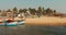 Mapusa, Anjuna, Goa, India - February 19, 2020: Fishermen Resting Near Pulled Boat From Sea.