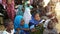 Maradi, Niger: Muslim school girls getting protection from the extreme heat in Niger under a shadow of a tree, outside of their sc