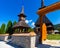 Maramures gate and monastery from Maramures villages, from Romania, with traditional and specifically Romanian wooden architecture