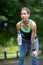 Marathon female athlete running drinking water