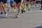 Marathon running race, runners feet on road, sport, fitness and healthy lifestyle