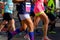 Marathon running race, women runners feet on road