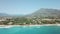 Marbella, golden mile beach, view of Puente Romano Bridge and in Background famous La Concha mountain. Emerald water colour