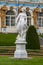 Marble allegory statue of Peace and blue Emperors Palace on Vackground in Tsarskoe selo museun in Saint Petersburg