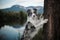 Marble black and white blue border collie stay near the lake