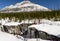 MARBLE CANYON, CANADA - MARCH 20, 2019: alpinists with backpacks preparing climbing down by ice to canyon