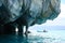 Marble caverns over blue water with canoe, Chile