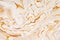 Marble golden, orange and white raster texture. Mineral stone macro surface. Color liquid flow, fluid effect wallpaper