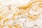 Marble golden and white raster texture. Mineral stone macro surface. Color liquid flow, fluid effect wallpaper.