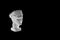 Marble head of young woman, ancient Greek goddess bust isolated on black background with copy space for text.