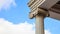 Marble pillar detail. Ancient ionic column of white ornate marble. Blue sky, under, close up view, banner