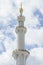 Marble pillar with domes of Sheikh Zayed Grand Mosque with blue sky in the morning at Abu Dhabi, UAE